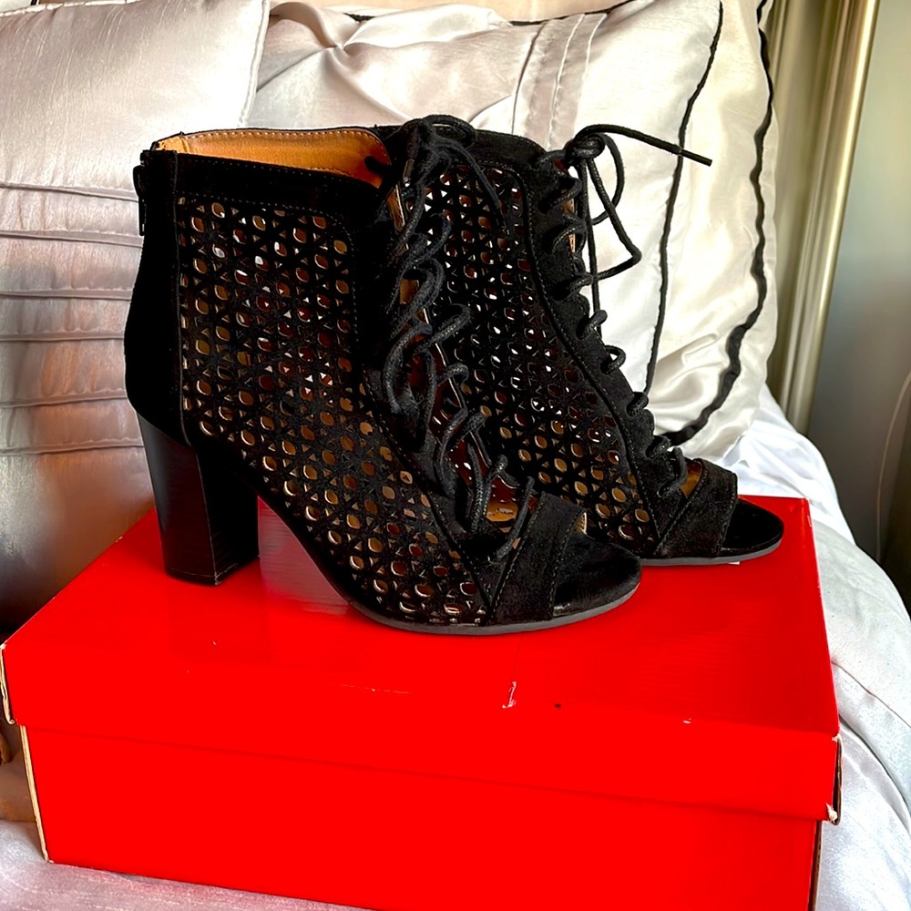 Black lace up cut out heels size 6. Worn but good condition.